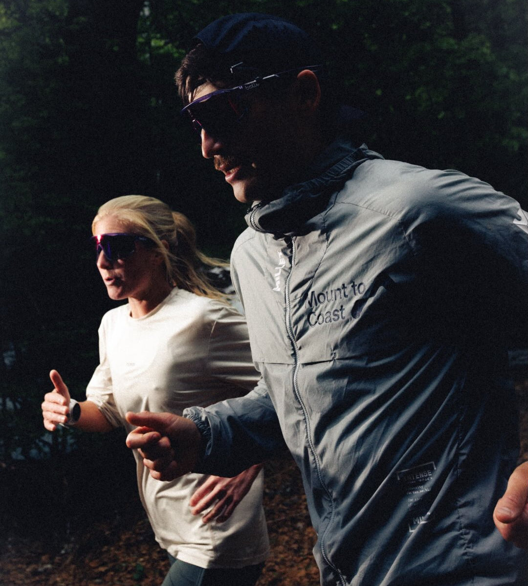 Two people running outdoors with bolle running sunglasses