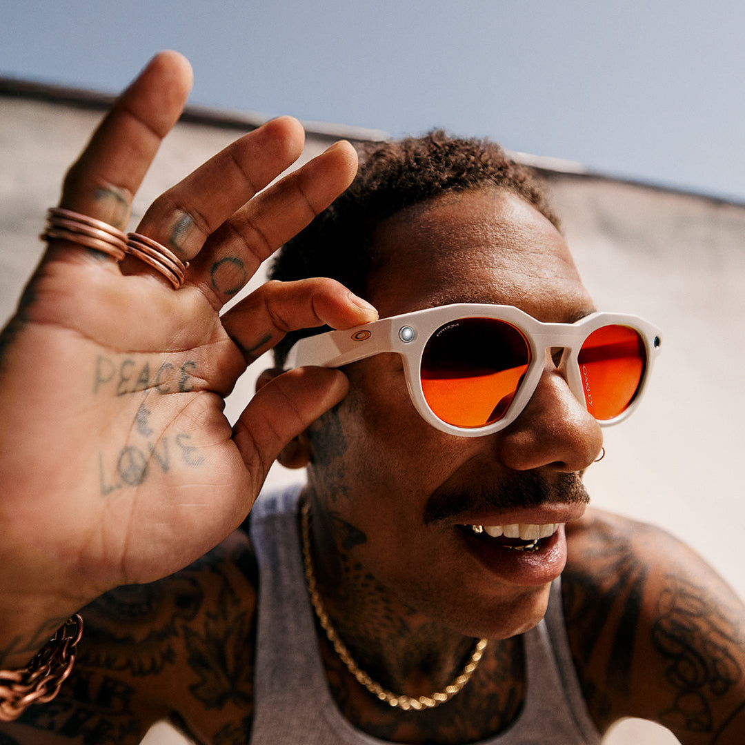 Man wearing Oakley Meta sunglasses with orange lenses
