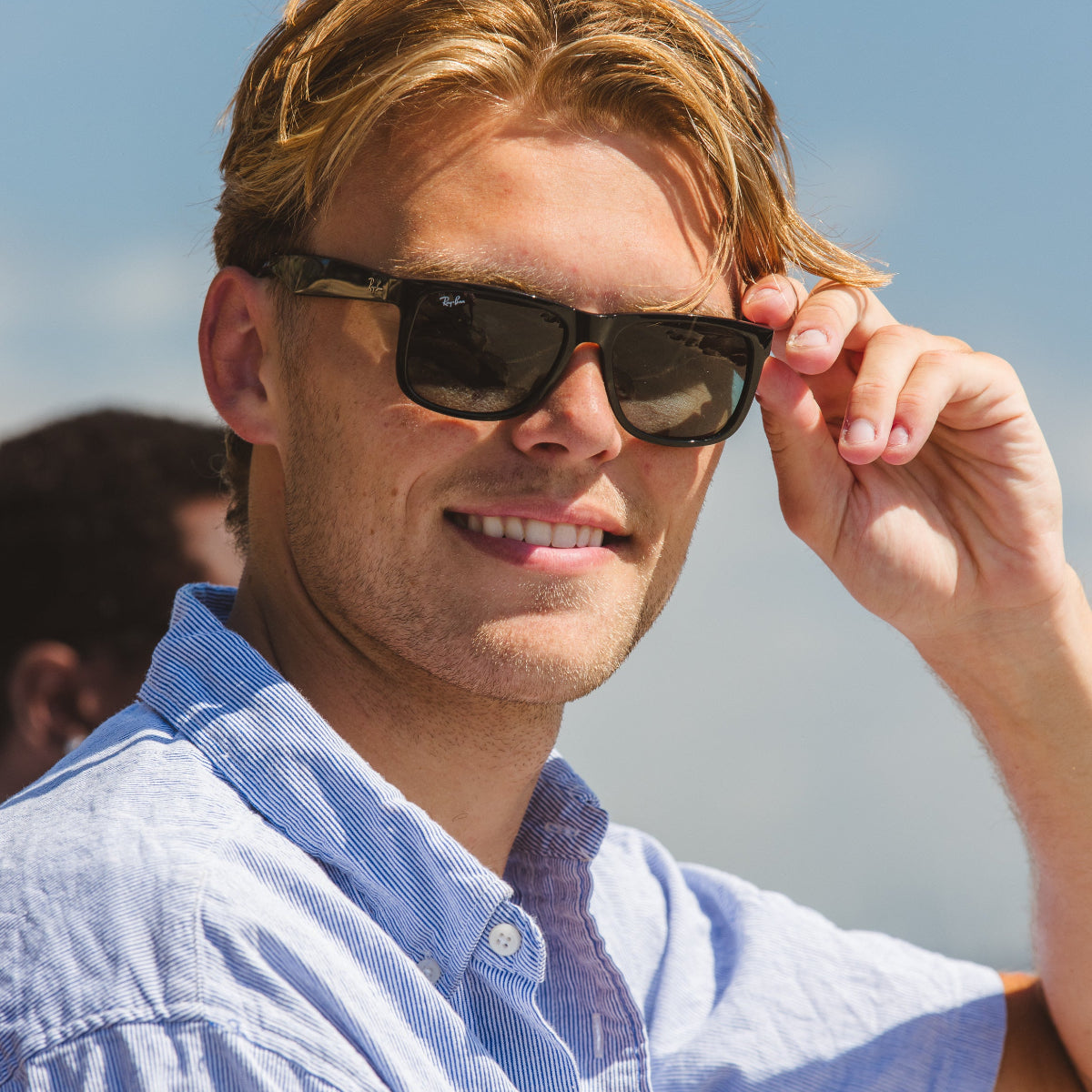 Man wearing ray-ban sunglasses 